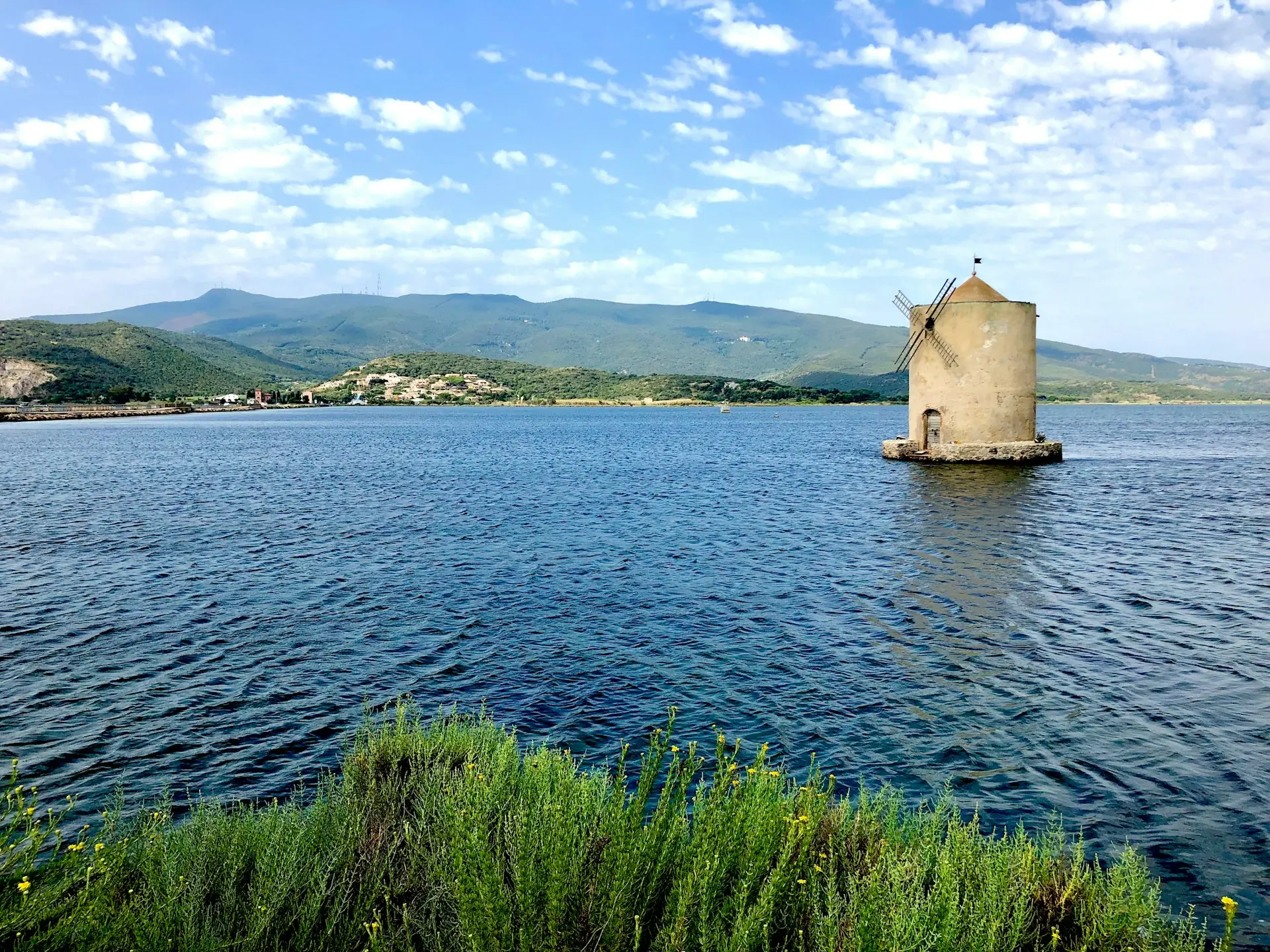 a large body of water with a tower in the middle of it