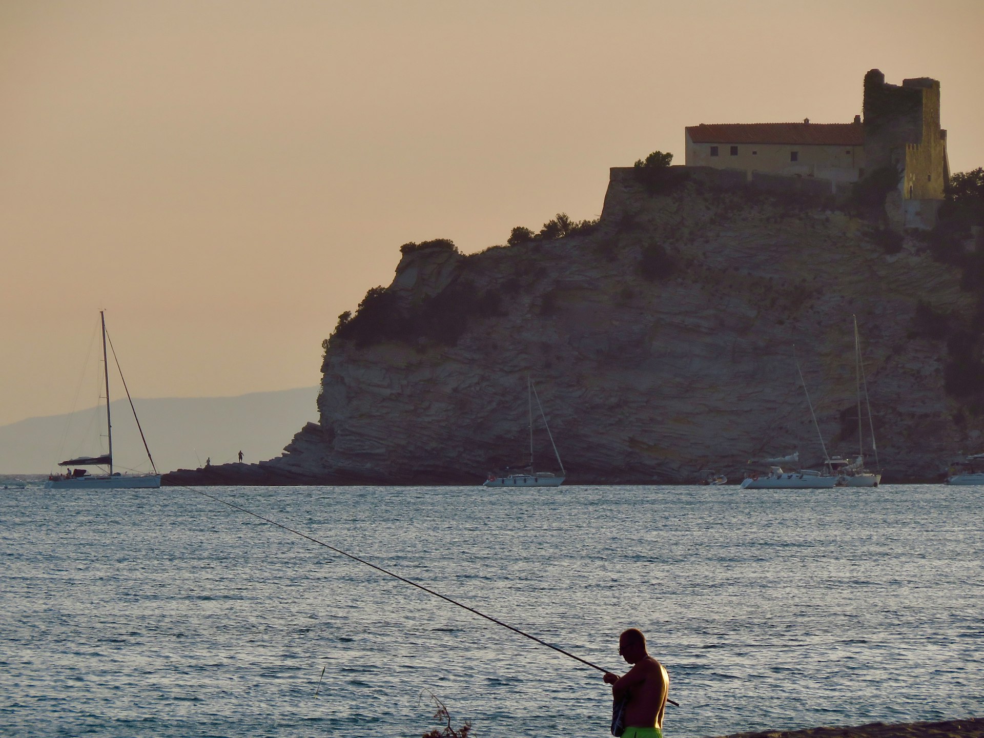 a man fishing in the water